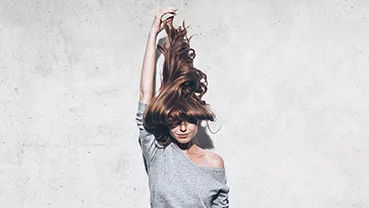 Photo Definicire small format, a woman holding her hair