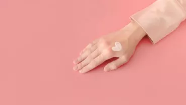 hand with a heart cream