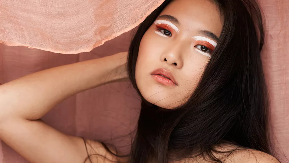 Asian woman wearing eyeshadow